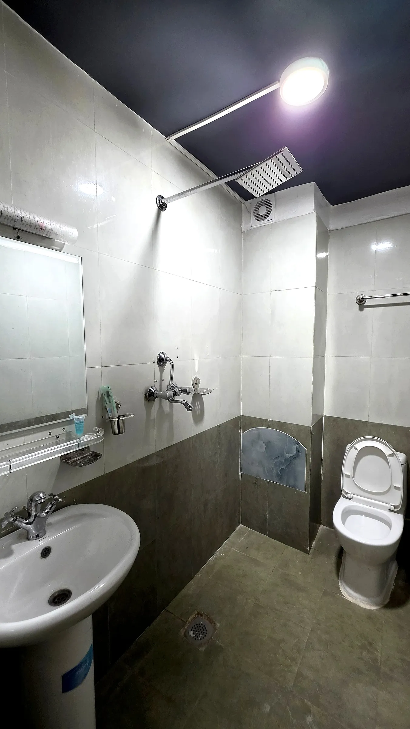Modern attached bathroom with hot shower